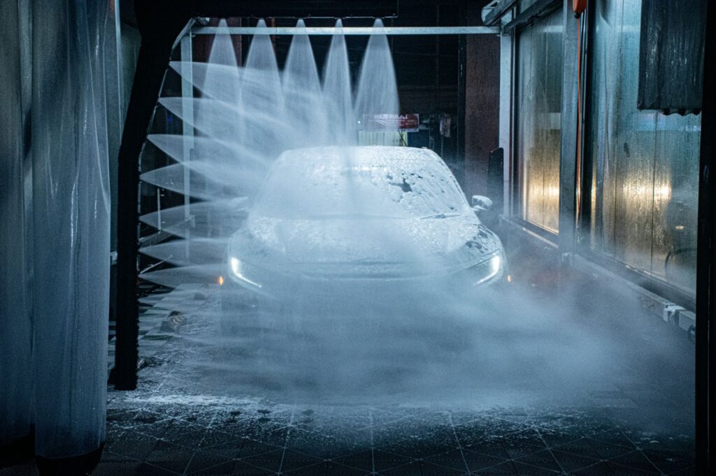 A car being washed in a car wash.