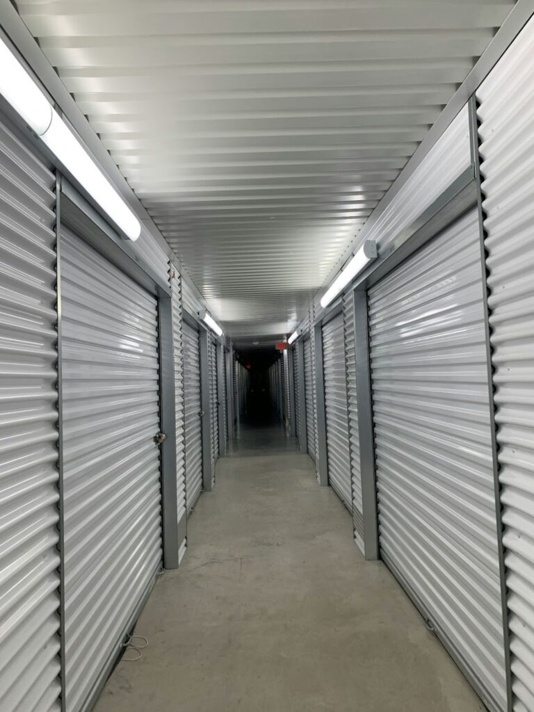 Mini storage building cost: A hallway in a self-storage facility.