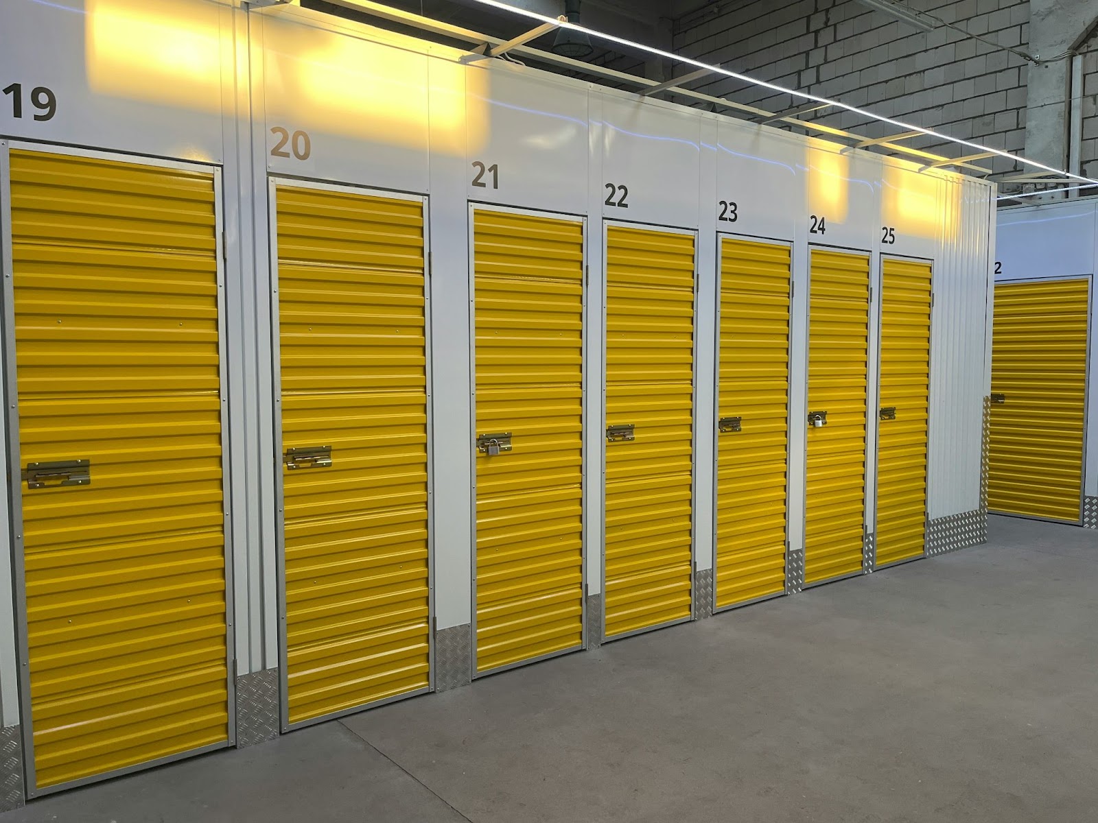 Several large lockers in a self-storage facility.