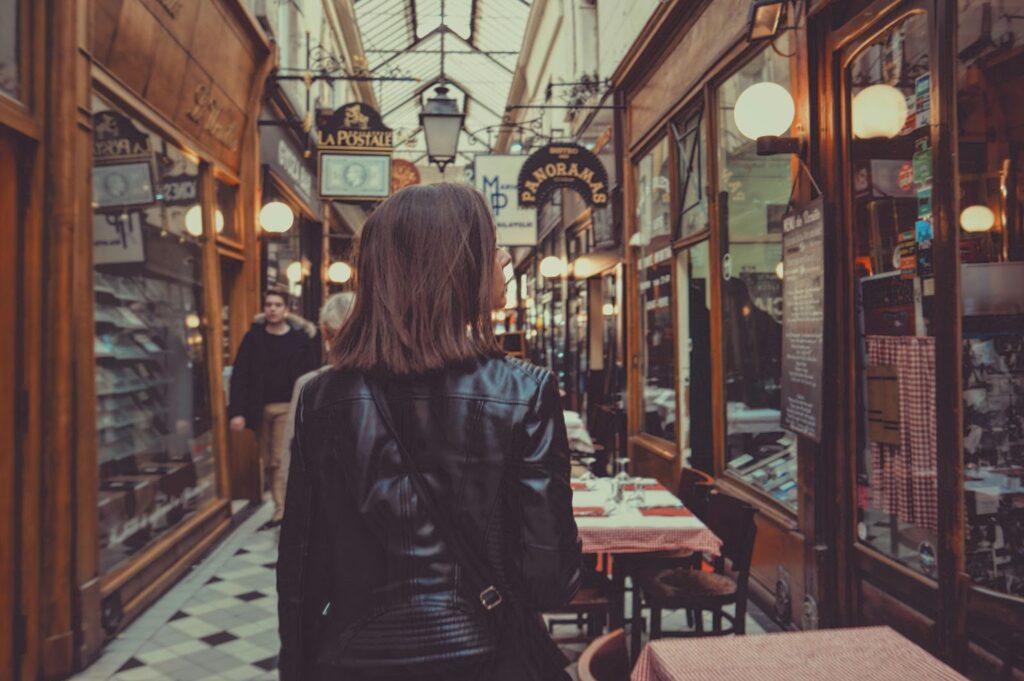 A Woman walking through a mall.