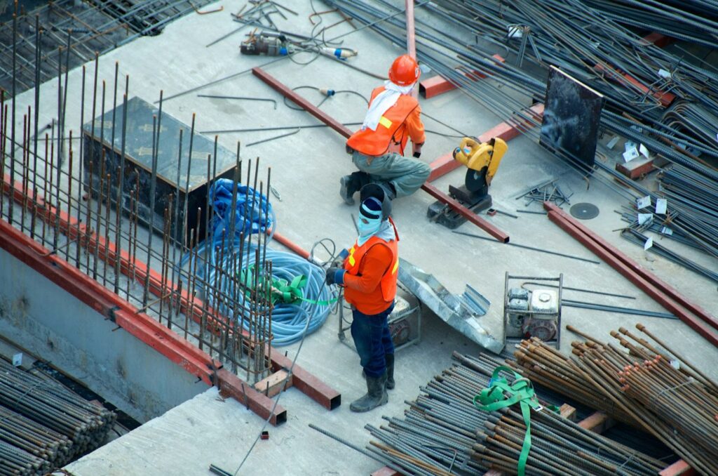 Two men working on a commercial construction site.