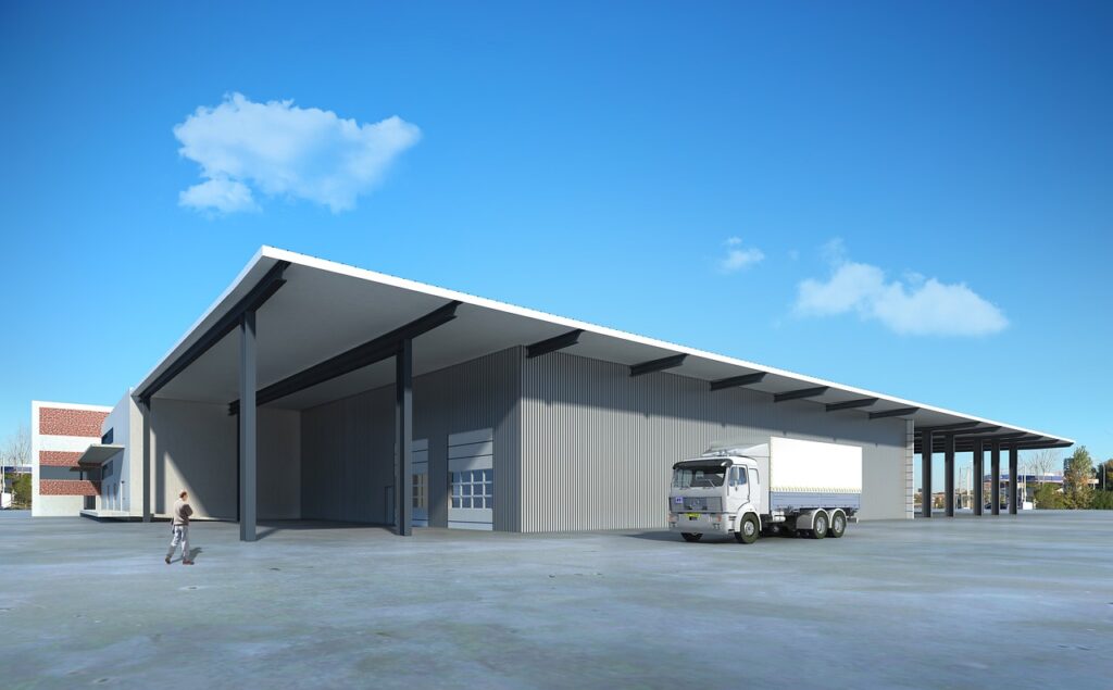 A newly built warehouse and a truck next to it.