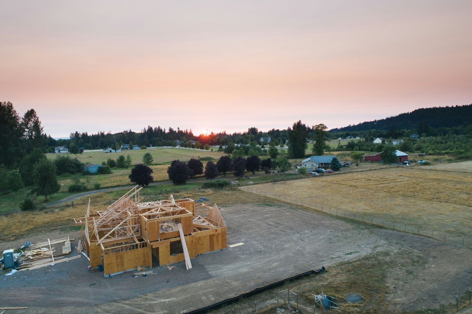 A residential building is being constructed with a wooden foundation.